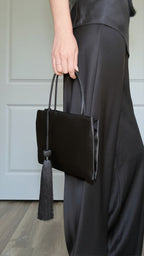 Minimalist Black Nylon Top Handle Bag with Statement Silk Tassel Accent