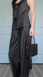 Minimalist Black Nylon Top Handle Bag with Statement Silk Tassel Accent